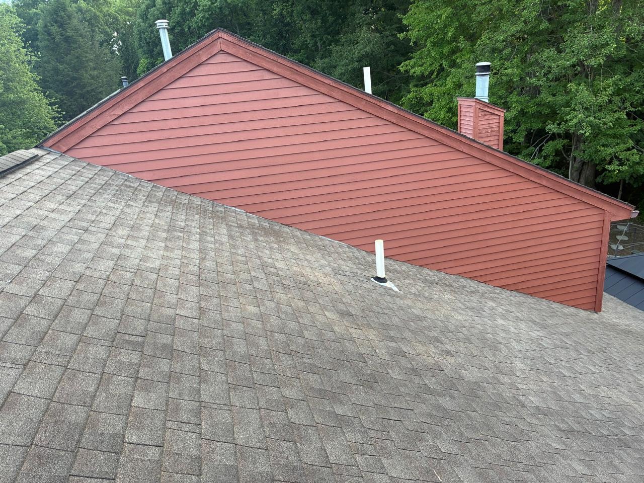 Total Siding Replacement — After: New Red Lap Siding Installed